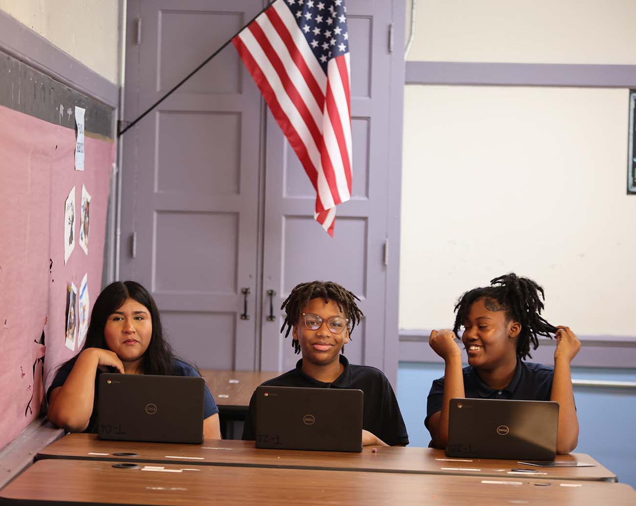 Teacher or school staff member warmly interacting with a student outside