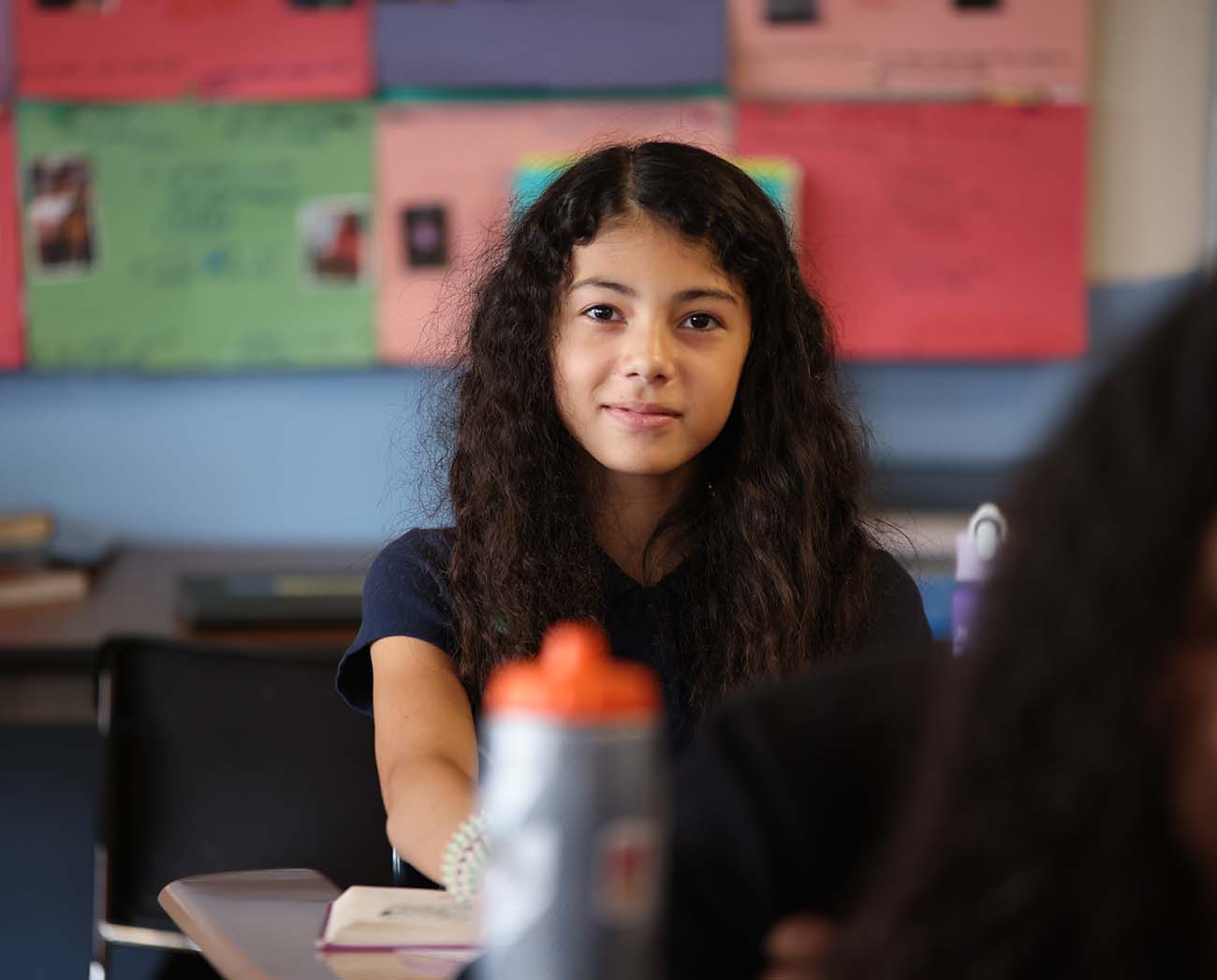 Smiling children together outdoors.